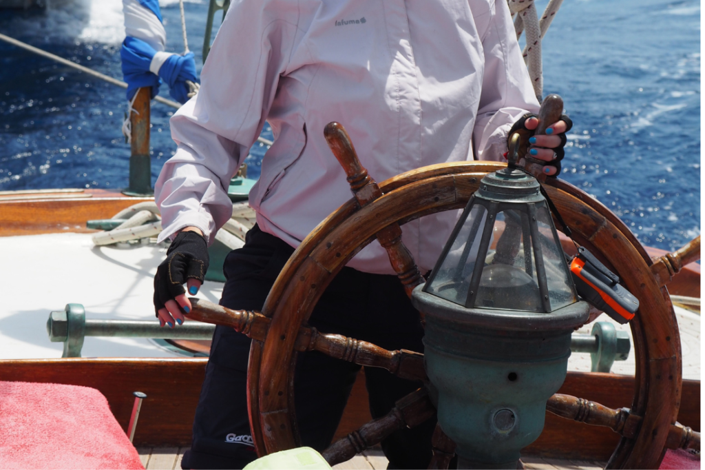 Practicing sailing maneuvers like tacking and steering